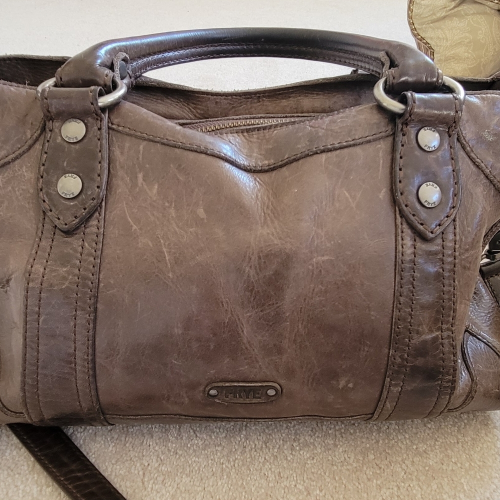 Frye satchel. Brown in color, slightly worn, 14 inches wide, 9inch ht, 6in depth